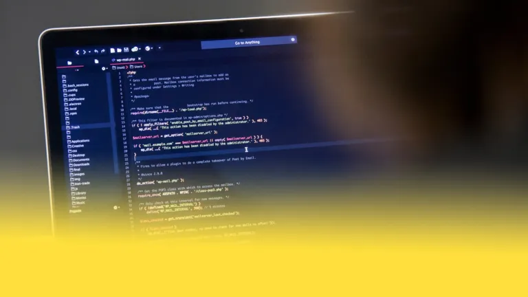 Photo of a laptop with code on it